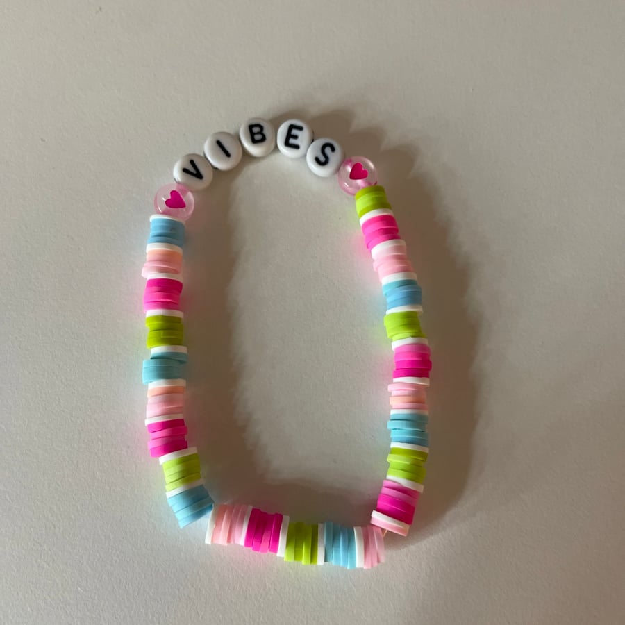 A cute vibes clay bead bracelet!