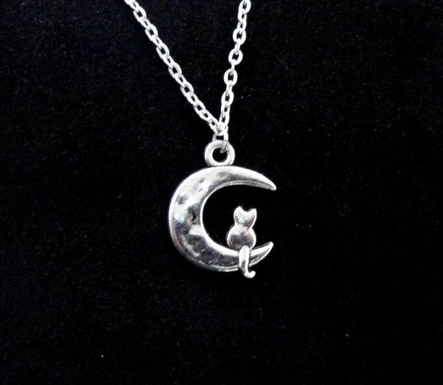 Cat on moon charm necklace