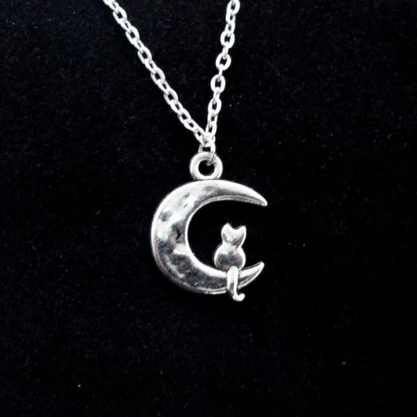 Cat on moon charm necklace