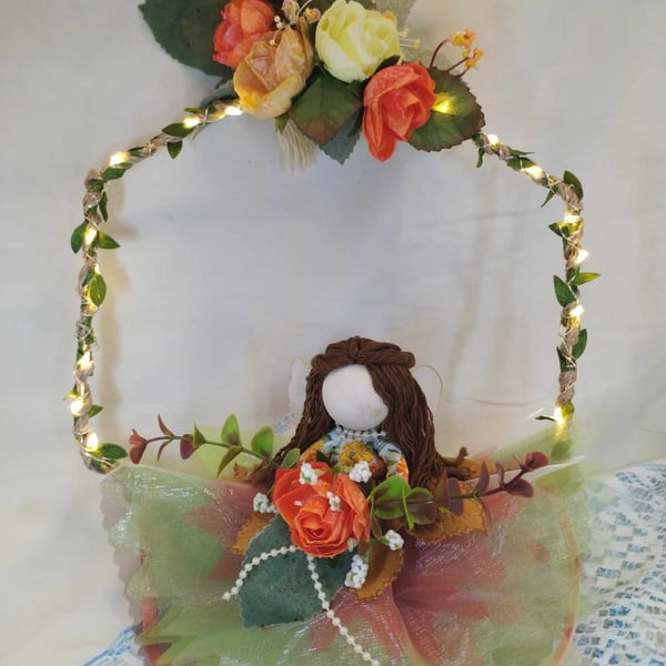 Autume Fairy doll on hoop with fairy lights and orange roses