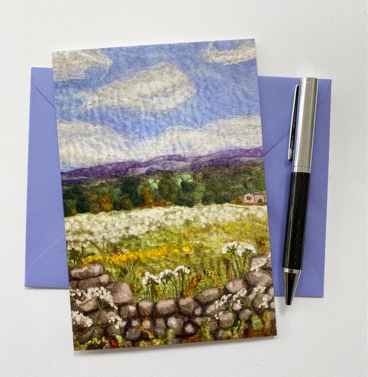 Meadow sweet field with Ilkley Moor in the distance. Spring summer countryside. 