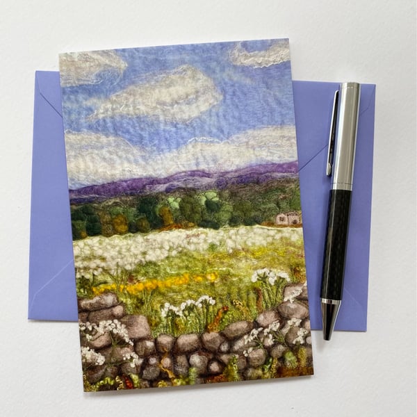Meadow sweet field with Ilkley Moor in the distance. Spring summer countryside. 