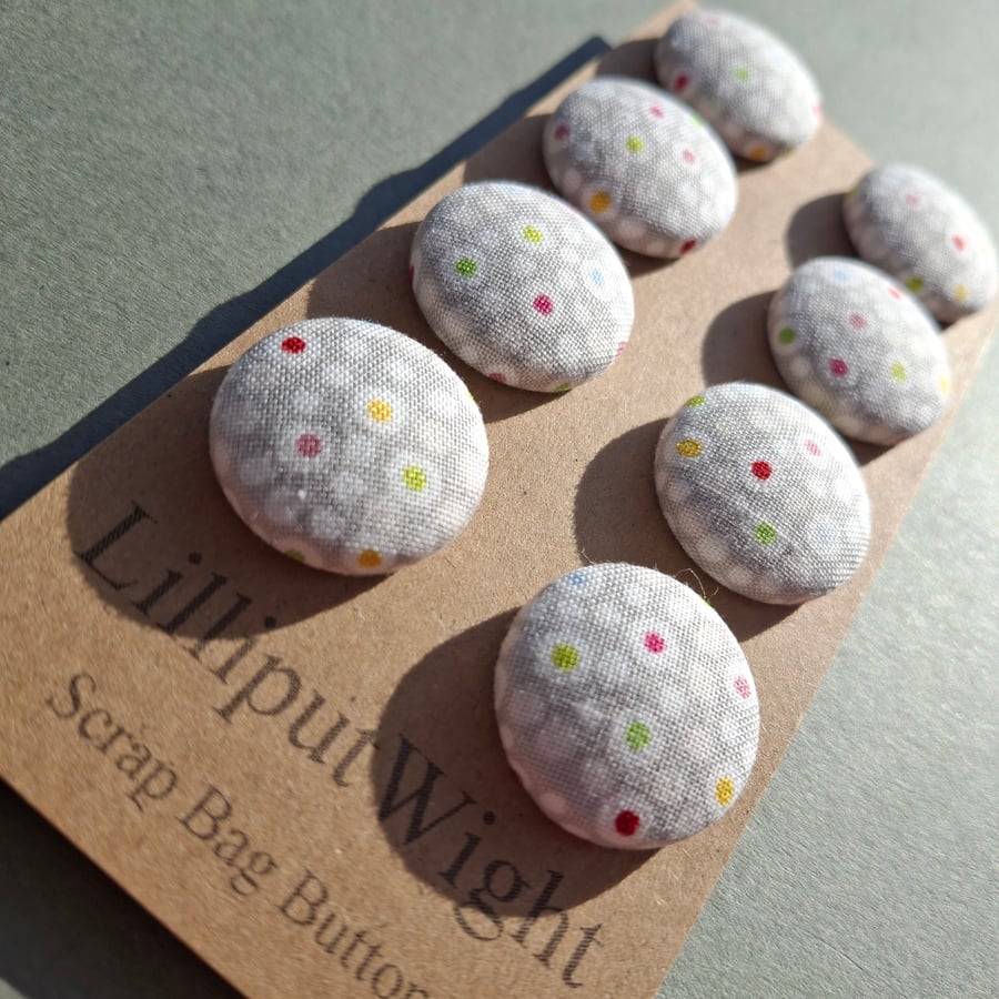 Set of eight scrap bag buttons - grey cotton fabric with colored circle design 