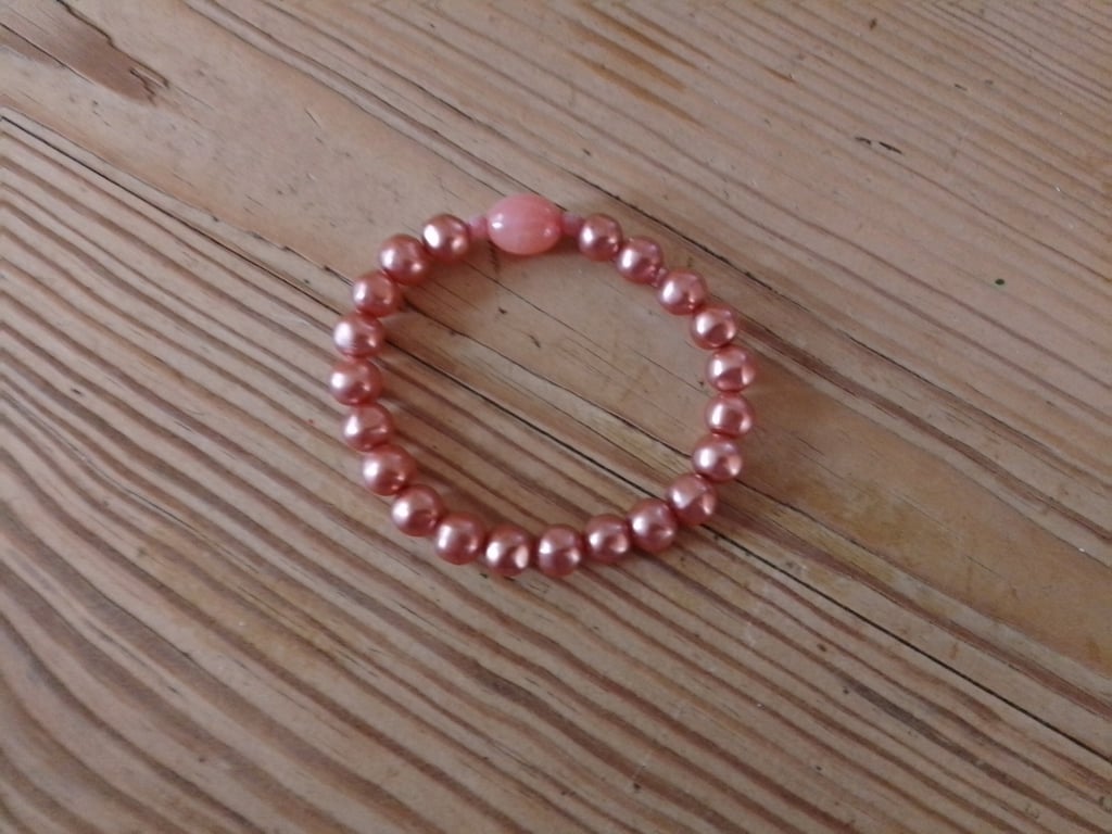 Handmade bracelet made using pre-loved beads. Small size.
