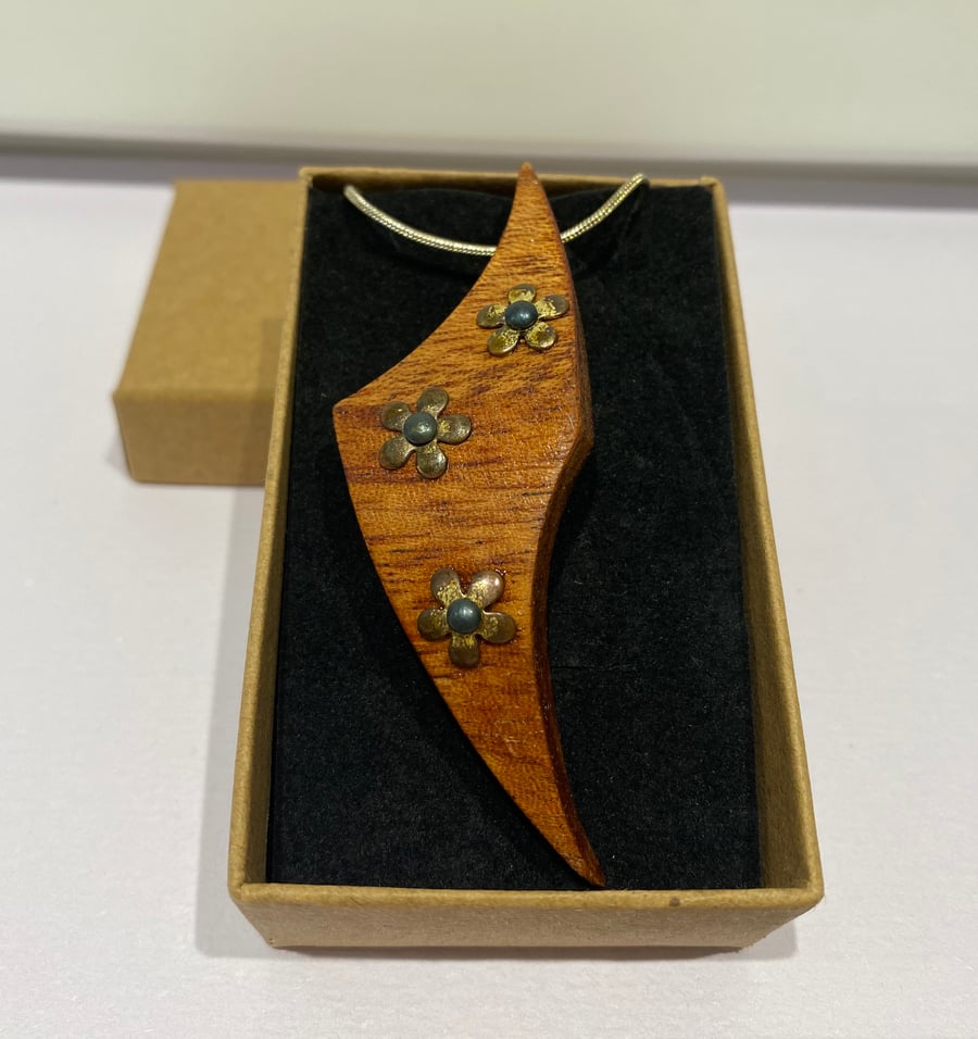 Handmade wooden pendant necklace with flower design