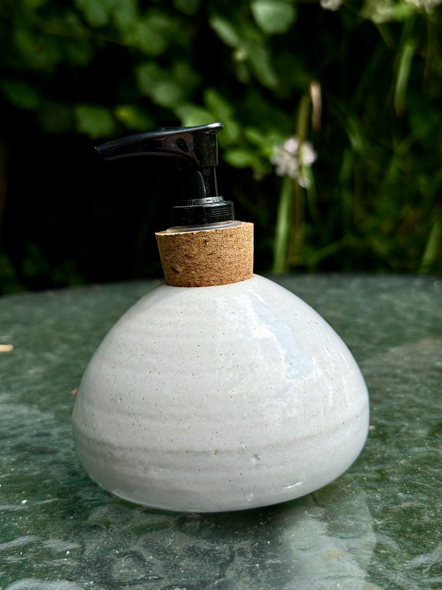 White hand -thrown stoneware soap dispenser with pump.