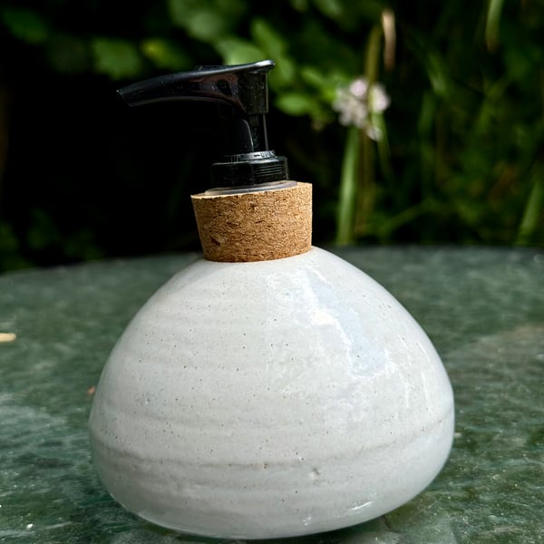 White hand -thrown stoneware soap dispenser with pump.