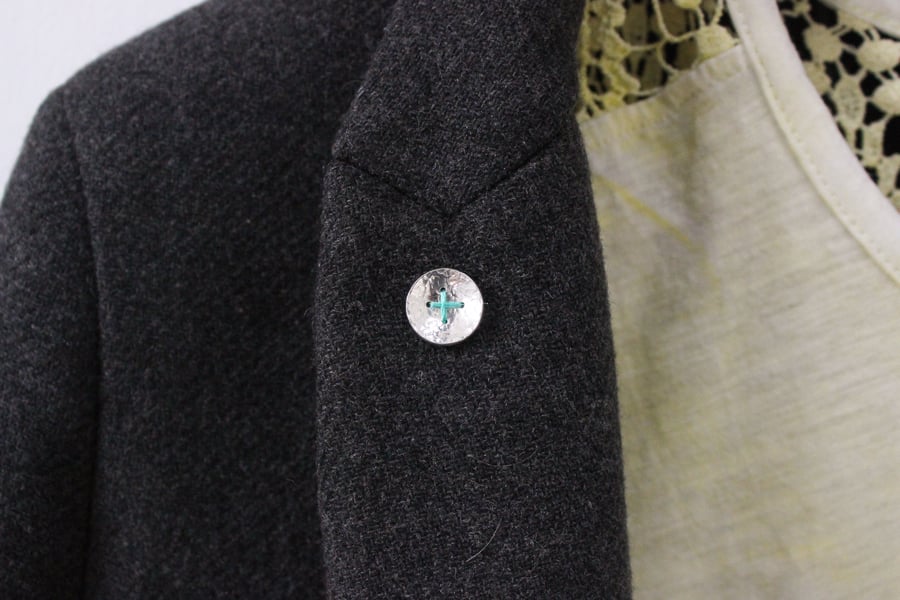 Silver button brooch with turquoise thread