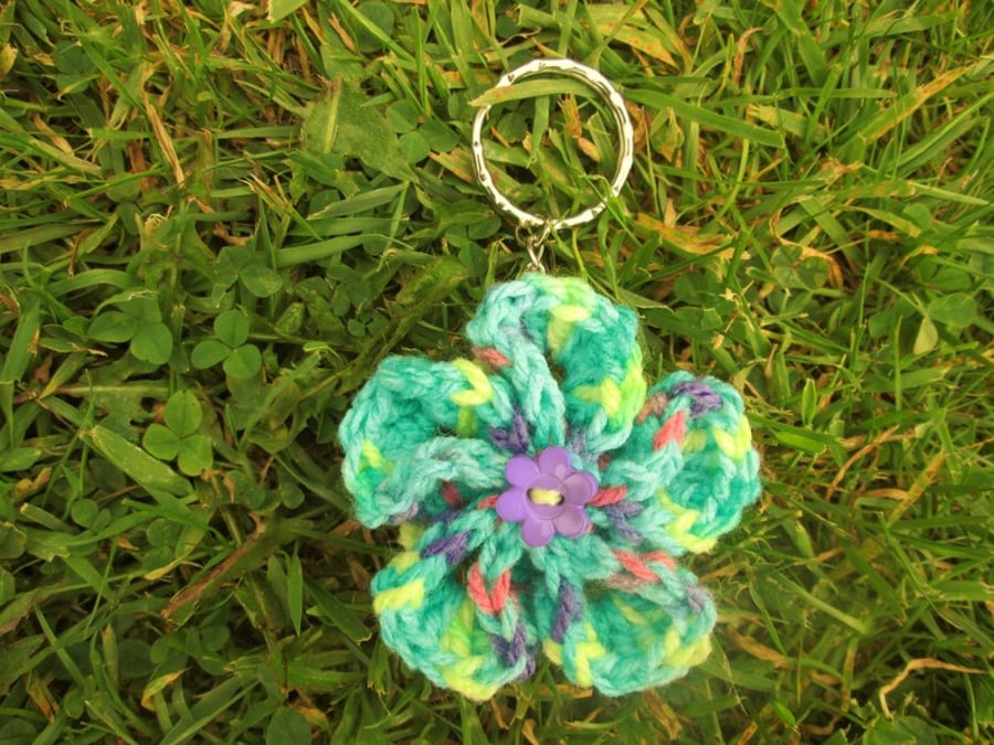 Green multicoloured crochet flower keyring or keychain with flower button