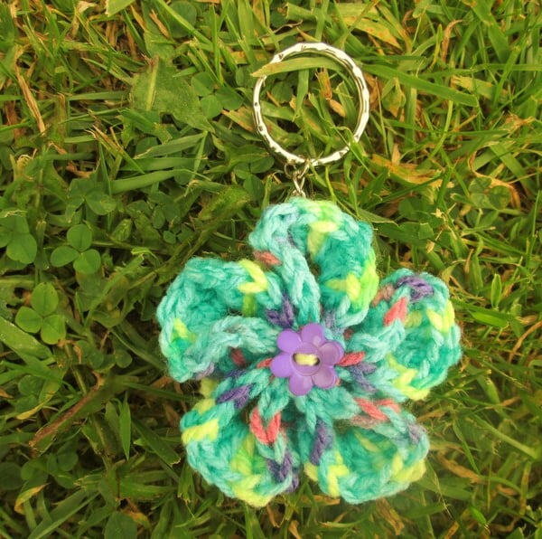 Green multicoloured crochet flower keyring or keychain with flower button