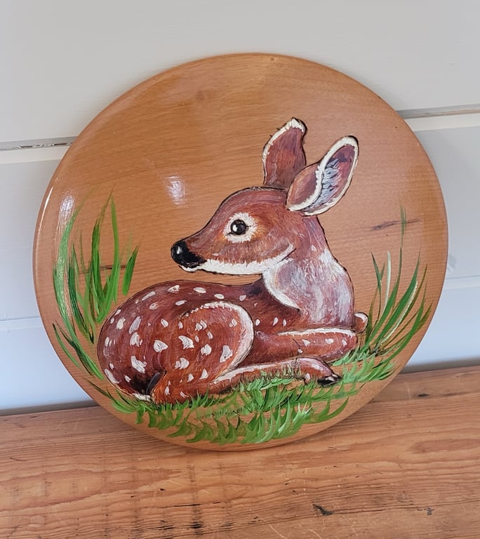 Round Wooden Plaque Decorated With A Resting Fawn