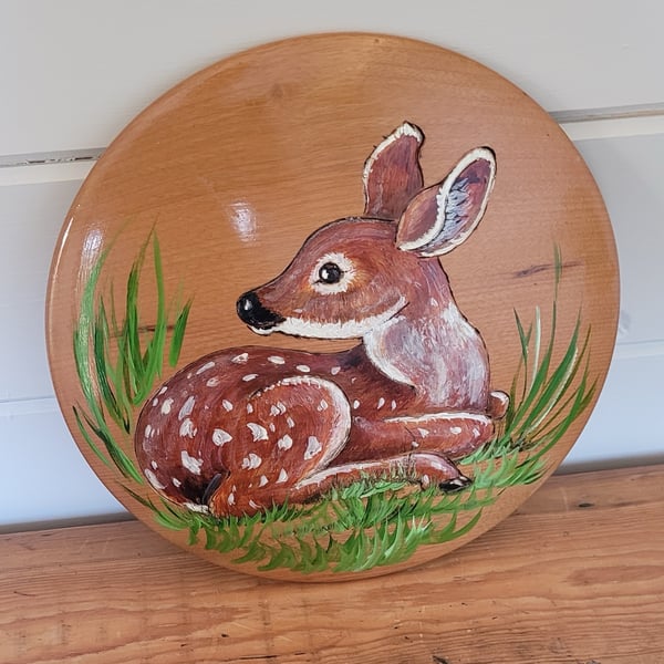 Round Wooden Plaque Decorated With A Resting Fawn