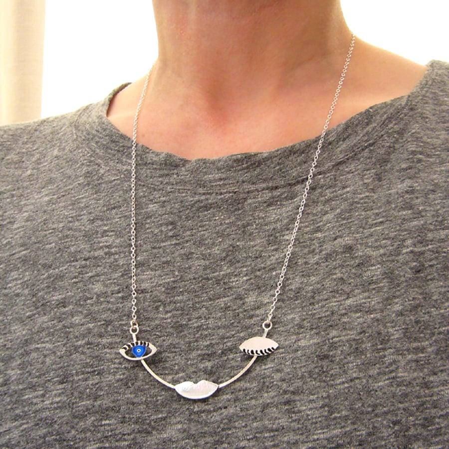 Unique sterling silver winking face necklace, modern jewellery