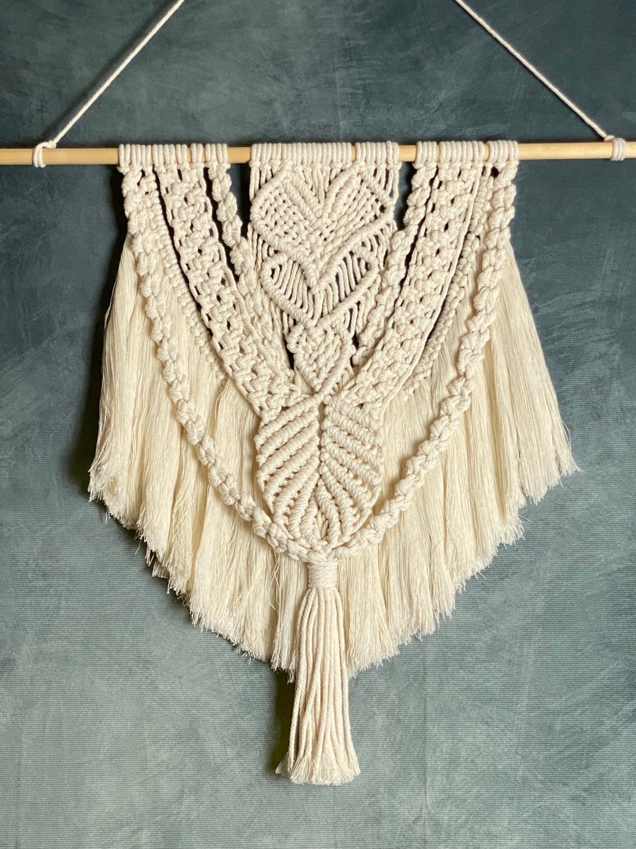 Macrame wall hanging with intricate heart knot design