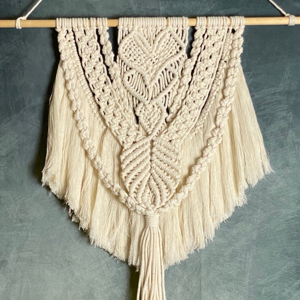 Macrame wall hanging with intricate heart knot design