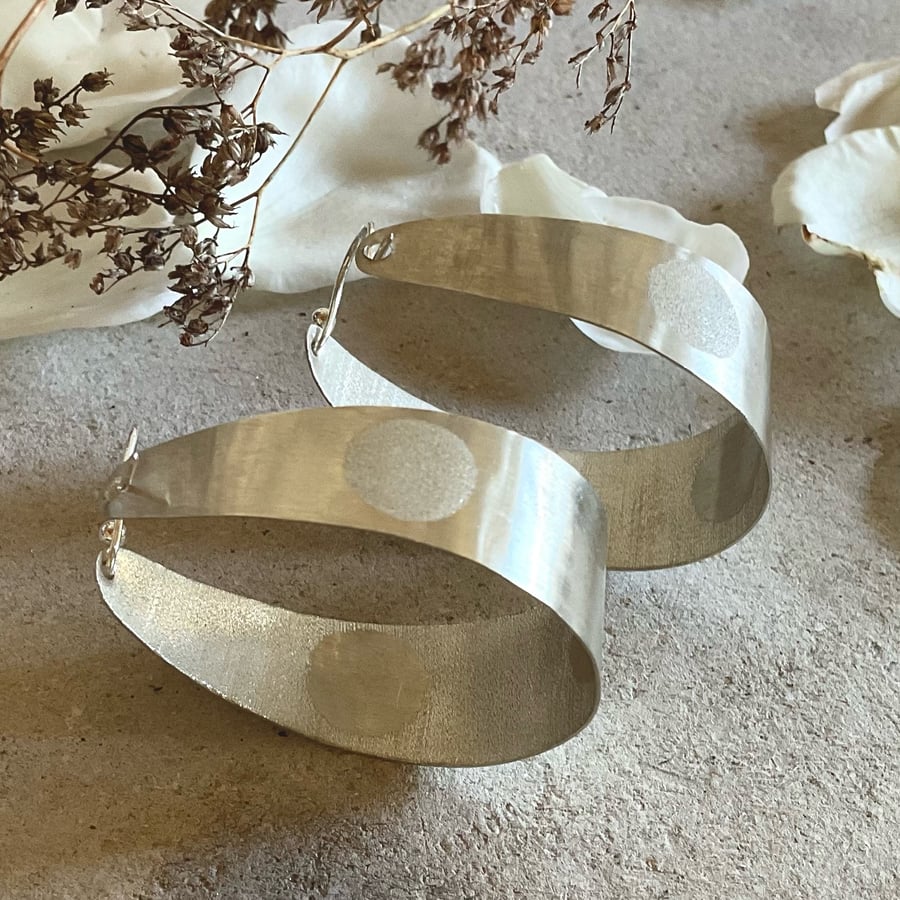 Large polka dot silver hoop earrings