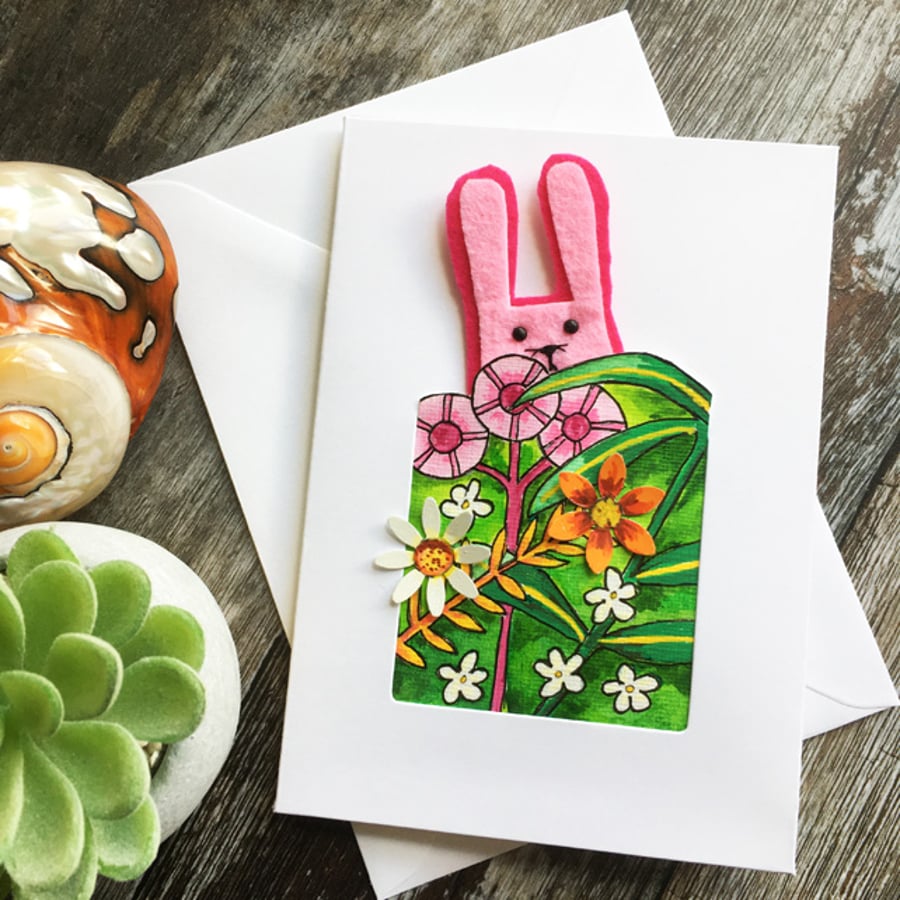 Handmade card. Petunia rabbit in the garden