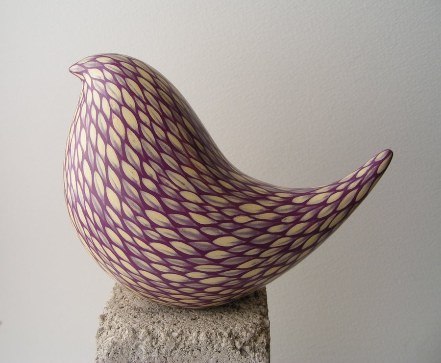 Painted bird (D) cream on blackberry