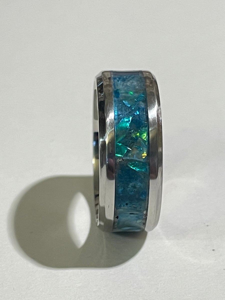 Resin hand carved ring with opal effect.