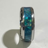 Resin hand carved ring with opal effect.