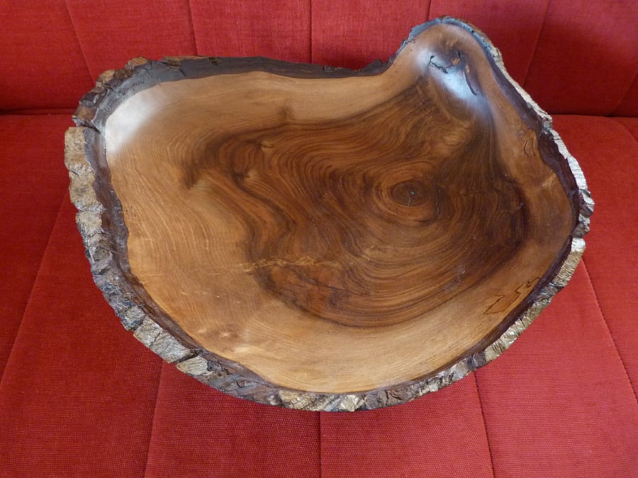 Very large walnut bowl , with the bark of the tree intact.
