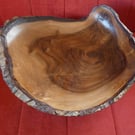 Very large walnut bowl , with the bark of the tree intact.