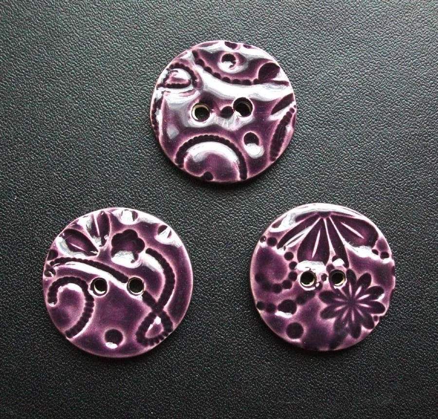 set of three large purple ceramic buttons 