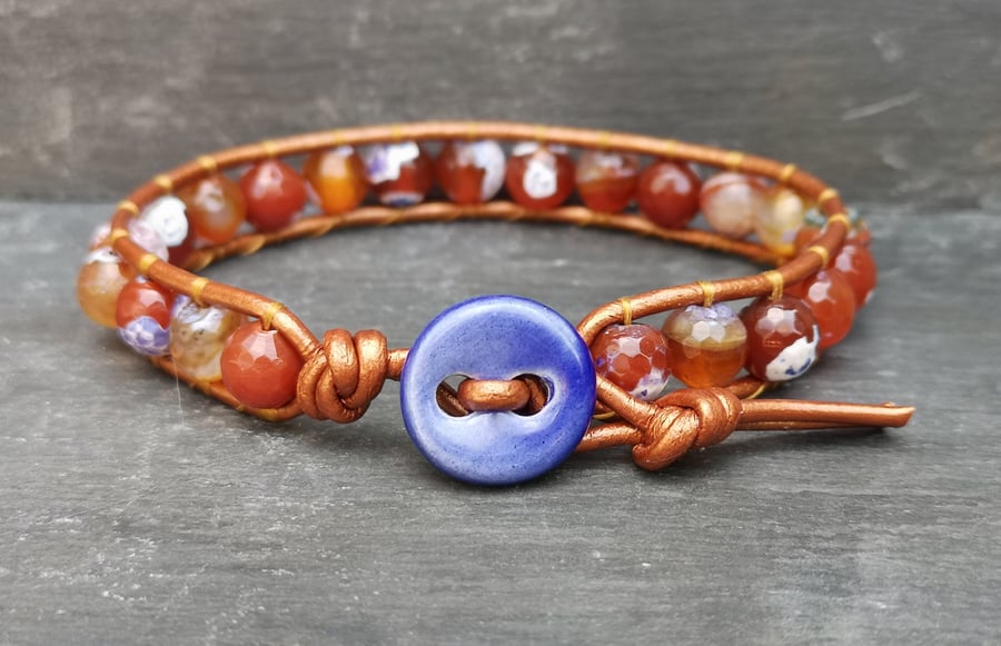 Fire agate bead and copper coloured leather bracelet with ceramic button 