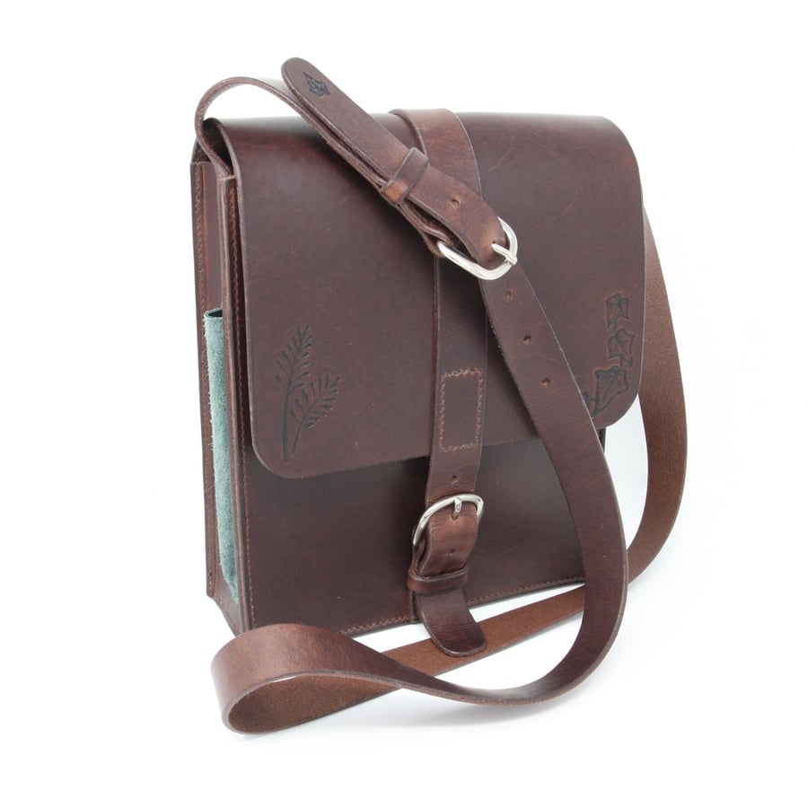 Brown leather shoulder bag with countryside motifs