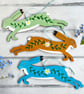 Whimsical folk style leaping hare hanging decoration for cottage core decor