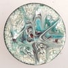 Brooch - round: scrolled turquoise and red-brown on white