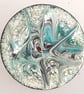 Brooch - round: scrolled turquoise and red-brown on white - Image 1