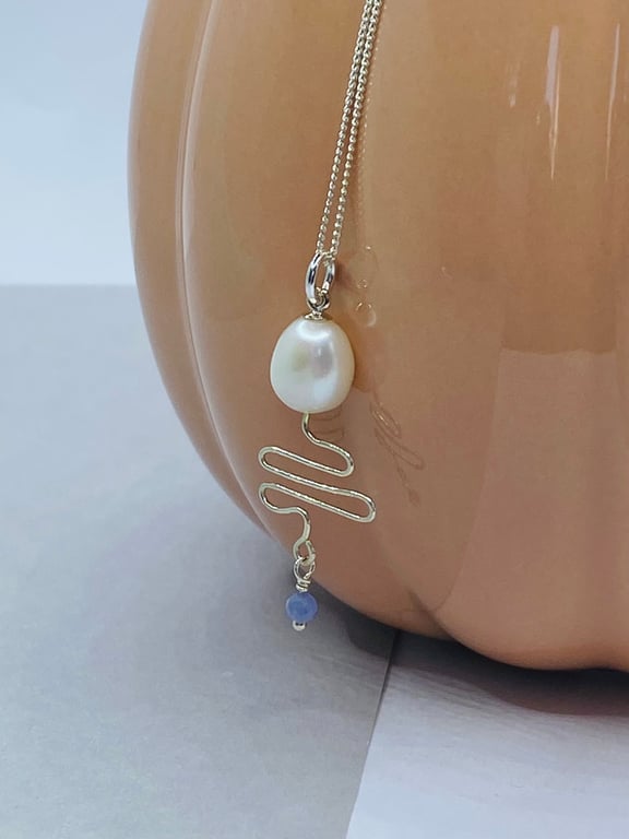Freshwater pearl and tanzanite pendant with sterling silver wire zigzag