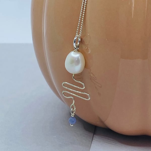 Freshwater pearl and tanzanite pendant with sterling silver wire zigzag