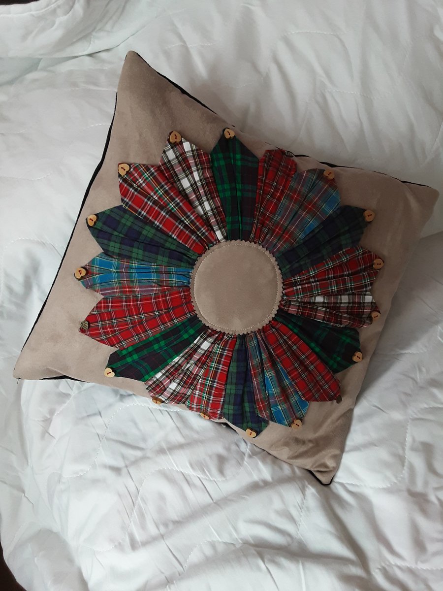 Beige faux Suede cushion with tartan design.