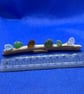 Frosted sea glass 'nuggets' on driftwood