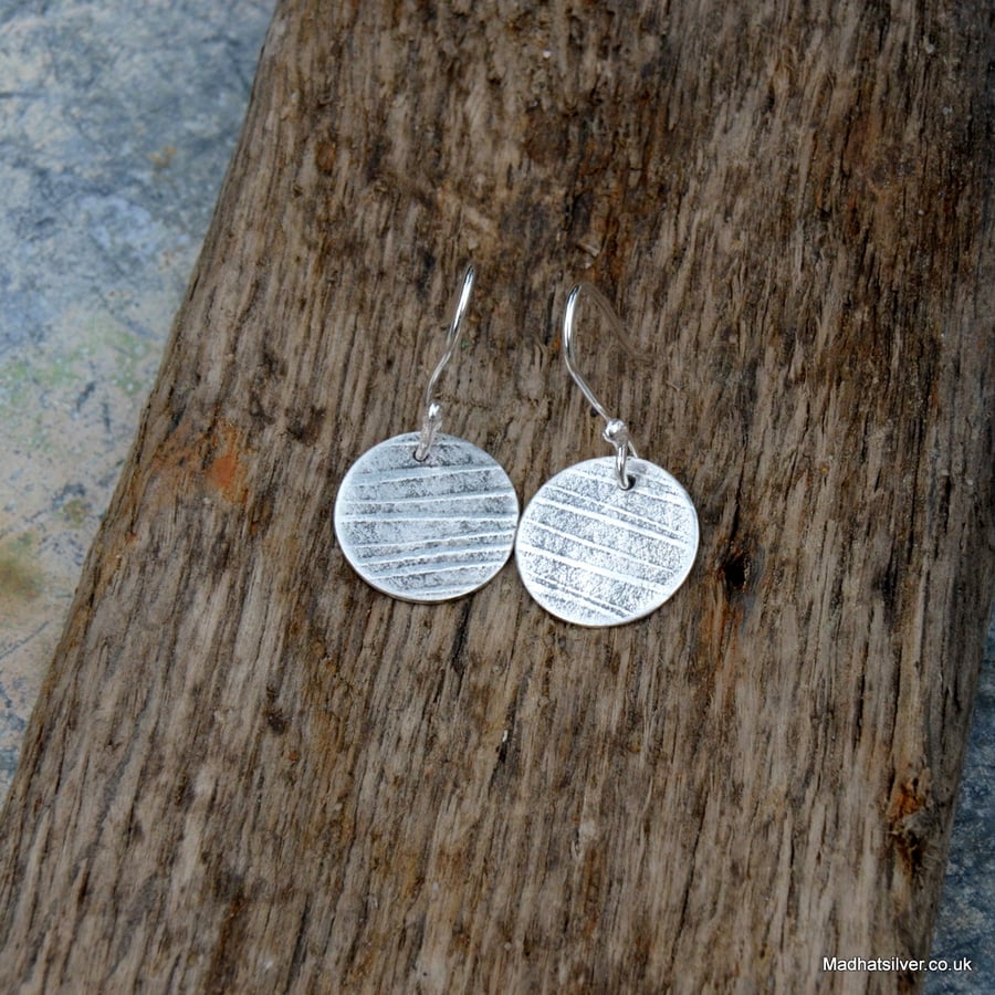 Sterling silver textured disc earrings