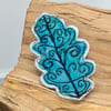 Embroidered oak leaf brooch. 