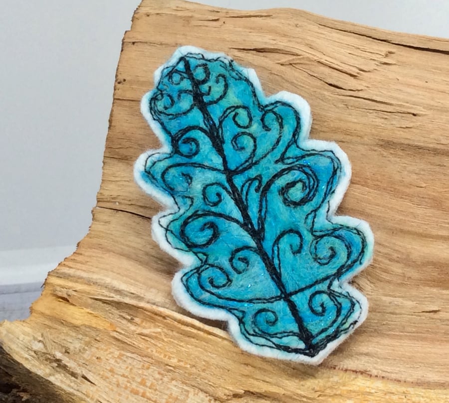 Embroidered oak leaf brooch. 