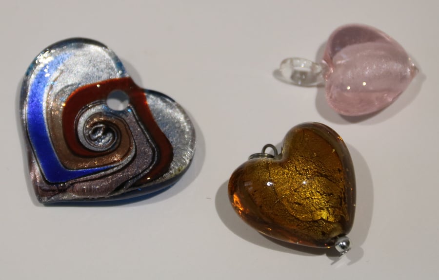 3 glass heart pendants, blue-multi, pink, golden brown