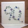 Floral hand embroidered age card