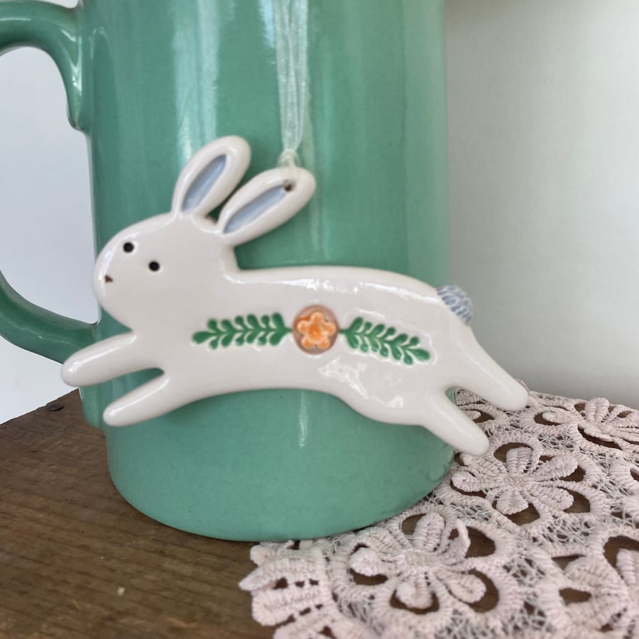 Ceramic Leaping Easter Bunny decoration orange flower