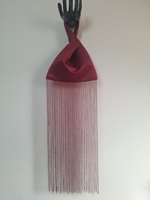 Burgundy Duchess satin Japanese knot bag with 50cm fringe and satin lining.