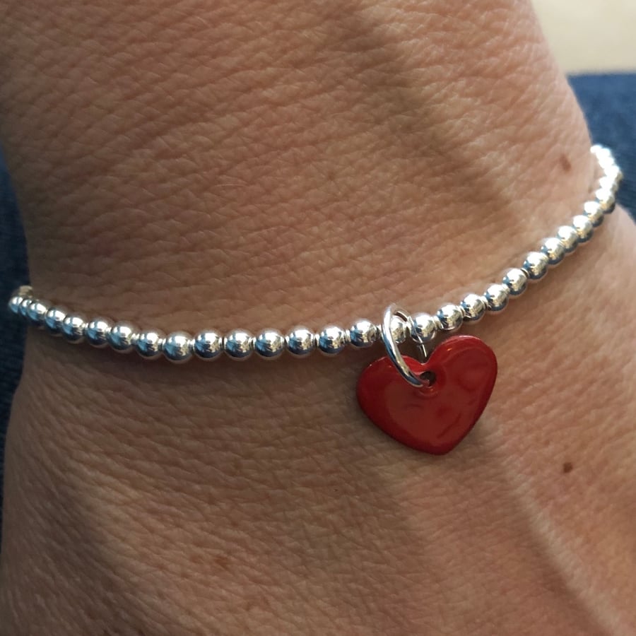  Red enamel heart on silver beaded stretch bracelet. Stacking bracelet.