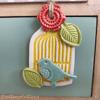 Pottery birdcage decoration with flower and leaves