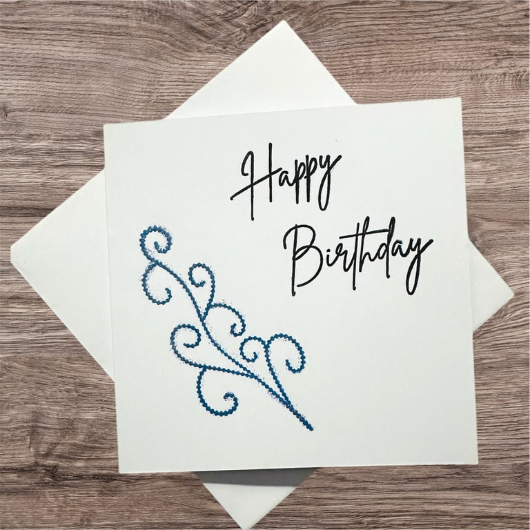 Happy birthday blank card with a sparkling blue scroll. 