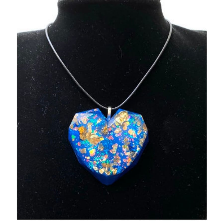 Blue and gold glitter large heart pendant on a black cord chain.