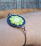 Boho Daisy Bezel Bracelet (Olive Green & White) on Denim with Adjustable Chain - Image 1
