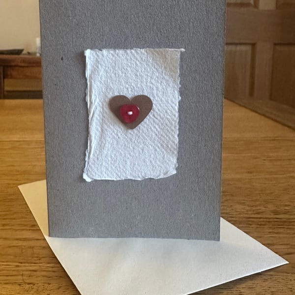 Greetings card with heart motif & red heart shaped button 