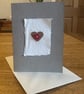 Greetings card with heart motif & red heart shaped button 
